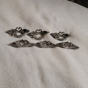Six pewter swan napkin ring holders